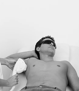 man receiving laser hair removal on underarm